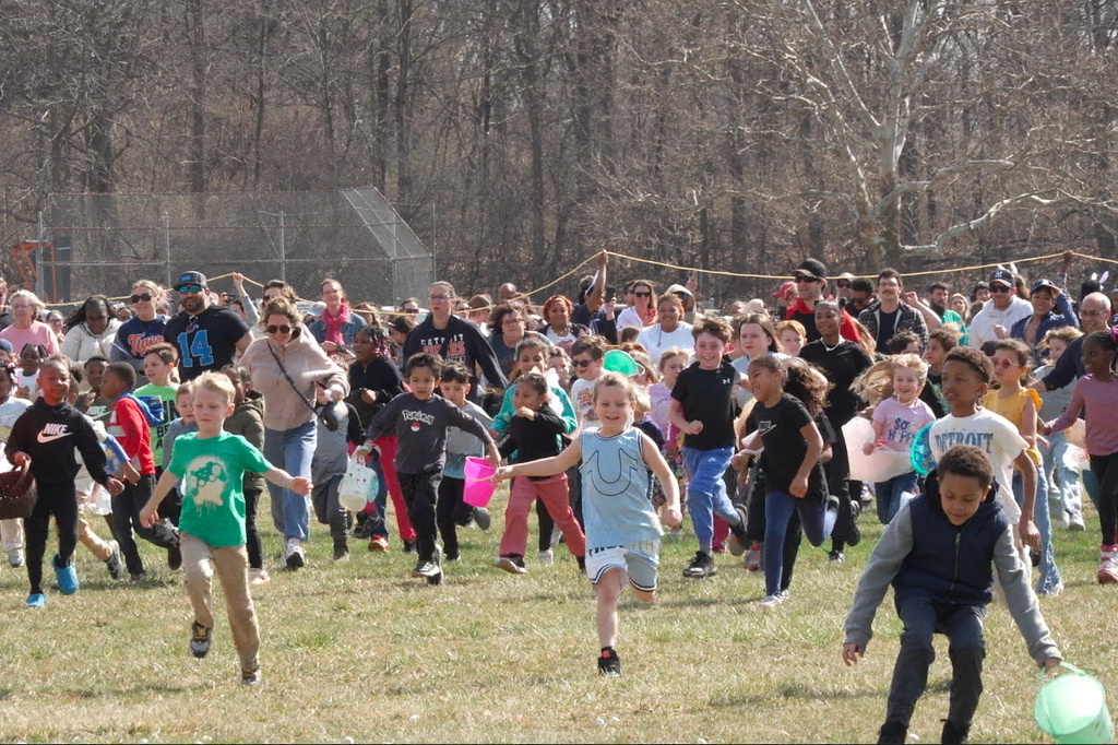 Children collect marshmallows dropped from a helicopter