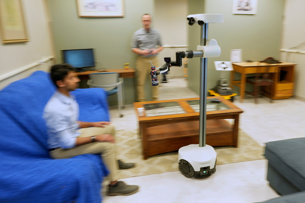 A robot is helping a couple with disabilities live more independently